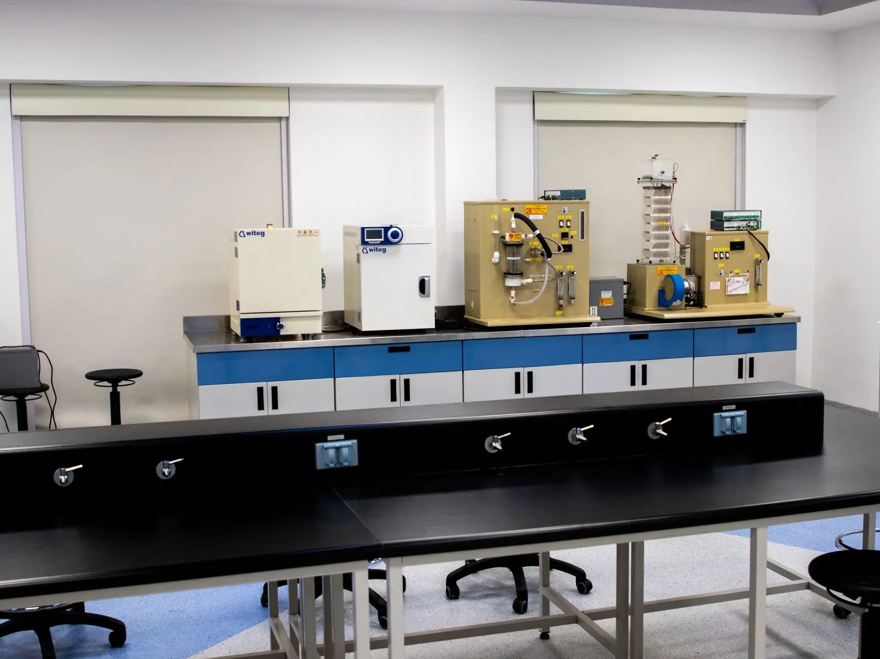 Rows of ultra-low temperature freezers in a large biobank storage facility