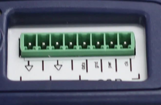 Close detail of the Eltek GD14E green 8-way numbered screw-terminal block for wiring the external RHT-20E probe and two thermistor temperature inputs