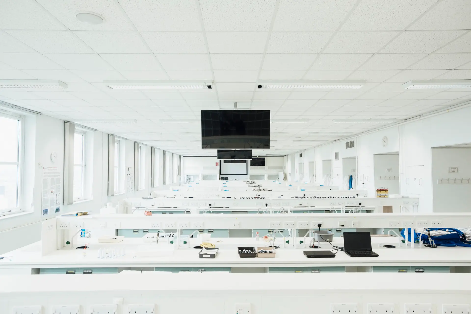 A large multi-bench laboratory of the kind Eltek monitors across many zones, where a resilient wireless mesh keeps readings flowing reliably