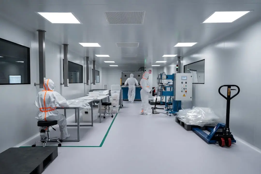 The interior of a classified clean room, with ceiling supply diffusers, benching along one wall and process equipment down the far end, a space whose temperature has to be characterised in three dimensions rather than at a single point