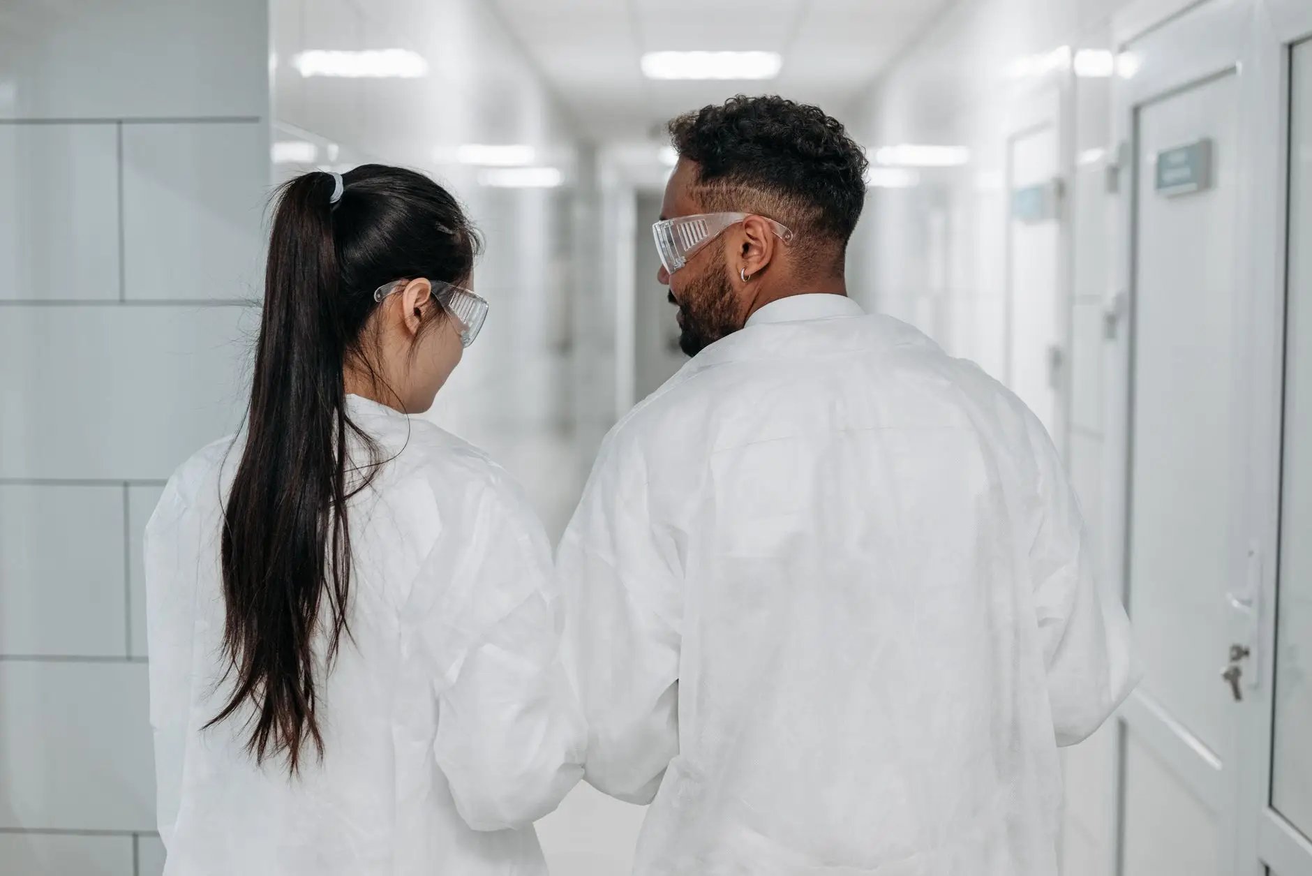 Researchers working in a university laboratory, the kind of research estate where Eltek monitors ultra-low temperature freezers and cryogenic storage that hold years of irreplaceable samples
